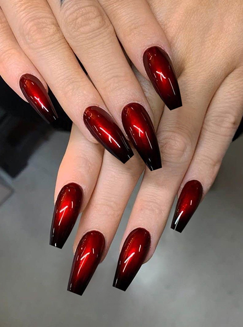 Premium Photo | A gold and black nail art design with gold and red